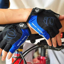 Load image into Gallery viewer, Cyclist wearing high-grip blue and black cycling gloves for protection and control.