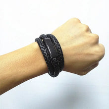 Cargar imagen en el visor de la galería, Stylish black leather USB bracelet charger worn on wrist, blending fashion with functionality for on-the-go power.