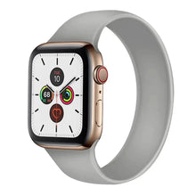 Load image into Gallery viewer, Apple Watch with a sleek grey band, showcasing fitness tracking features and modern design.