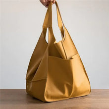 Charger l'image dans la galerie, Luxury vegan leather women's shoulder bag in soft mustard, large capacity, elegant design for style and practicality.