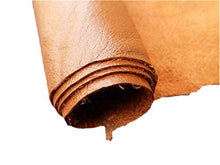 Load image into Gallery viewer, Close-up of rolled brown leather hide, perfect for crafting garments and accessories, made from durable cow skins, 8x11 inches.