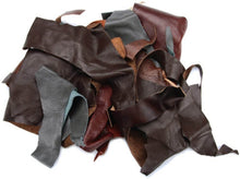 Load image into Gallery viewer, Assorted black leather scraps, 2-lb pack for crafts; ideal for wallets and jewelry, diverse shapes and sizes from garment cutting.