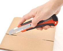 Cargar imagen en el visor de la galería, Person using eZthings heavy-duty 9mm snap-off blade cutter on cardboard for cutting materials like wallpaper, vinyl, and leather.