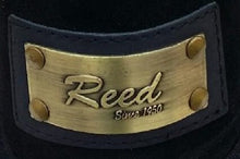 Load image into Gallery viewer, Close-up of Reed brand metal label on leather product, showcasing antique finish and craftsmanship.