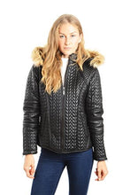Load image into Gallery viewer, Woman wearing a REED black quilted designer leather coat with faux fur-trimmed hood and zip-out feature, showcasing stylish winter fashion.