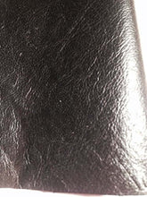 Load image into Gallery viewer, Close-up of REED leather hide in black, soft sheepskin with an antique finish, ideal for crafting unique art pieces, 7 to 10 SF.