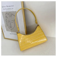 Load image into Gallery viewer, Yellow crocodile pattern PU leather women&#39;s shoulder bag displayed against framed artwork.
