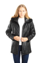 Load image into Gallery viewer, Woman wearing a black leather jacket with fur collar on a white background
