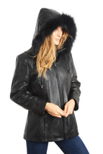 Load image into Gallery viewer, Woman wearing a black leather jacket with a fur-lined hood on a white background
