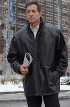 Load image into Gallery viewer, Man wearing REED 34&#39;&#39; Raglan Car Coat in luxurious lamb leather with zip-out lining, showcasing classic style and modern twist.
