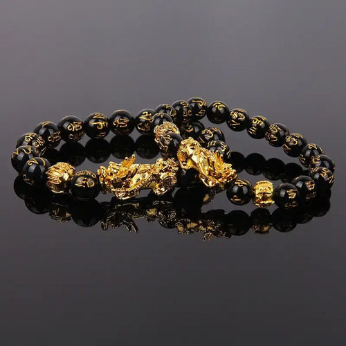 Feng Shui black beads bracelet with gold Pixiu charm for wealth and prosperity