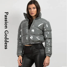 Load image into Gallery viewer, Model wearing shiny gray PU leather winter jacket with glossy finish, highlighting stylish chic design for cold weather fashion.
