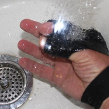 Load image into Gallery viewer, Waterproof flashlight fishing glove in use, showcasing LED light feature and durability under running water.

