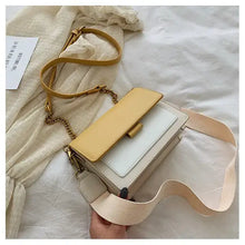 Load image into Gallery viewer, Stylish designer leather crossbody shopping bag with yellow flap and beige strap on a white fabric background
