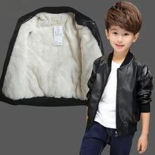 Cargar imagen en el visor de la galería, Boy wearing a stylish vegan leather and fur jacket, showcasing its luxurious fur lining. Ideal winter wear for fashion-conscious kids.
