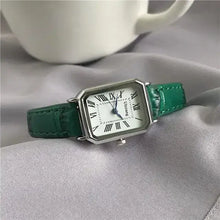 Load image into Gallery viewer, Retro women&#39;s classic quartz watch with green vegan leather strap on a soft fabric background.
