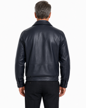 Charger l'image dans la galerie, A man wearing a Back of Reed leather jacket made in USA over a black button-down shirt, photographed against a plain white studio background.
