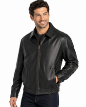 Charger l'image dans la galerie, A man wearing a  Reed leather jacket made in USA over a black button-down shirt, photographed against a plain white studio background.
