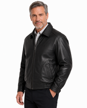 Charger l'image dans la galerie, A man wearing a Reed leather jacket made in USA over a black button-down shirt, photographed against a plain white studio background.
