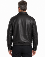 Charger l'image dans la galerie, A man wearing a Back of Reed leather jacket made in USA over a black button-down shirt, photographed against a plain white studio background.
