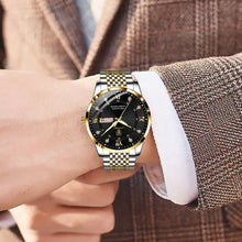 Load image into Gallery viewer, Men&#39;s stainless steel watch with a sleek, elegant design and black dial, showcased on wrist of man in suit, perfect for modern style.
