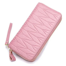 Load image into Gallery viewer, Pink leather female travel purse with zigzag pattern, features secure zip closure and wrist strap. Elegant and durable travel accessory.
