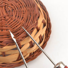 Load image into Gallery viewer, Tailor&#39;s awl and needle set for arts and crafts with wicker basket background, ideal for sewing and creative projects by eZthings.

