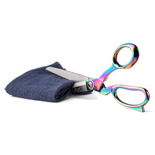 Load image into Gallery viewer, Rainbow-handle heavy duty scissors cutting blue fabric, ideal for arts and crafts, eZthings brand, perfect for professional or hobby use.
