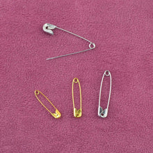 Charger l&#39;image dans la galerie, Safety pins on pink fabric from eZthings Sewing Accessories Replenishment Kit for Arts and Crafts.
