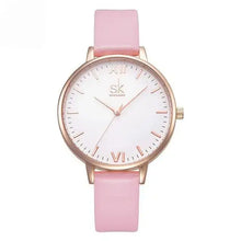 Load image into Gallery viewer, Luxury pink leather watch with gold accents, featuring a white dial and roman numerals, blending elegance and precision for timeless style.
