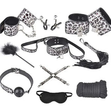 Cargar imagen en el visor de la galería, 10-piece vegan leather bondage set with leopard print, featuring cuffs, blindfold, rope, feather tickler, and more BDSM accessories.
