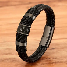 Load image into Gallery viewer, Woven leather rope wrapping stainless steel men&#39;s bracelet on wooden surface, showcasing its sleek design and high-quality craftsmanship.
