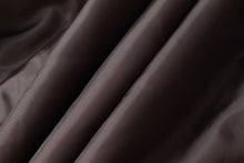 Charger l'image dans la galerie, A close-up of draped dark brown satin fabric with soft folds and a subtle sheen.
