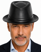 Load image into Gallery viewer, A close-up portrait of a man wearing a black leather fedora hat, a light blue dress shirt, and a dark navy blazer against a plain white background.

