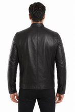 Load image into Gallery viewer, A man viewed from the back wearing a black leather jacket and black pants against a plain white background.
