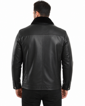 Charger l'image dans la galerie, A man viewed from the back wearing a black leather jacket with a dark collar, set against a plain white background.

