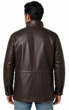 Cargar imagen en el visor de la galería, A man viewed from the back wearing a dark brown faux-leather jacket, paired with blue jeans, against a plain white background.

