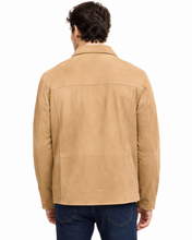 Charger l'image dans la galerie, A man viewed from the back wearing a tan suede jacket and dark blue jeans against a plain white background.
