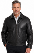 Charger l'image dans la galerie, A man wearing a Reed Black leather jacket made in USA over a black button-down shirt, photographed against a plain white studio background.
