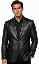 Charger l'image dans la galerie, A man wearing a black leather blazer over a black button-down shirt, photographed against a plain white studio background.
