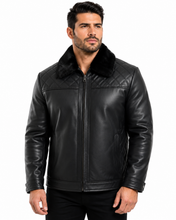 Charger l'image dans la galerie, A man wearing a black leather jacket with a black faux-fur collar, photographed against a plain white background.
