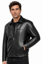 Charger l'image dans la galerie, A man wearing a black leather jacket with a front zipper, stand-up collar, and side pockets, paired with black jeans, against a plain white background.
