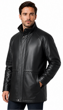 Cargar imagen en el visor de la galería, A man wearing a black leather jacket with a stand-up collar and front zipper, posed against a solid white background.
