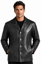 Cargar imagen en el visor de la galería, A man wearing a black leather jacket with silver-tone snap buttons over a black shirt, photographed against a plain white studio background.
