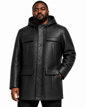 Charger l'image dans la galerie, A man wearing a black textured faux-leather hooded jacket with front flap pockets and a snap-button closure, photographed against a plain white background.
