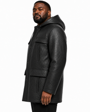 Charger l'image dans la galerie, A man wearing a black textured hooded jacket, shown in a side profile against a plain white background.
