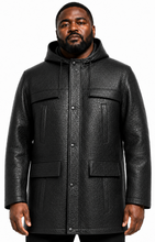 Charger l'image dans la galerie, A man wearing a black textured leather hooded jacket with front flap pockets and snap-button closure, photographed against a plain white background.
