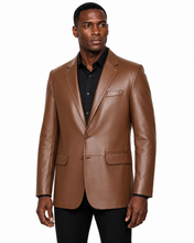 Charger l'image dans la galerie, A man wearing a brown real-leather blazer over a black collared shirt and black pants, photographed against a plain white background.
