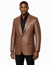 Charger l'image dans la galerie, A man wearing a brown real -leather blazer over a black collared shirt and black pants, standing against a plain white background.
