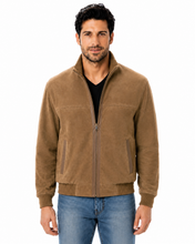 Load image into Gallery viewer, A man wearing a brown suede zip-up jacket over a black t-shirt and blue jeans, photographed against a solid white background.
